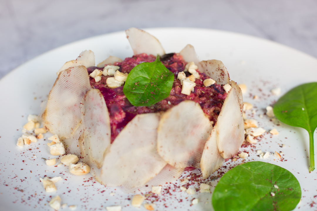 Recipe:  Millet with red cabbage and turnips with Jerusalem artichoke carpaccio, walnuts, hazelnuts and sumac