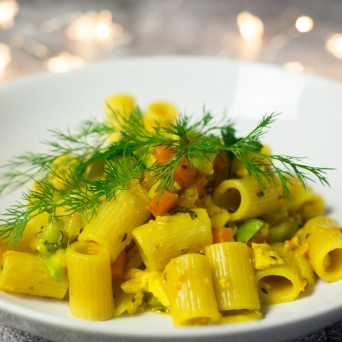 Pasta with oat cream, tofu crumble, fresh turmeric and lots of vegetables