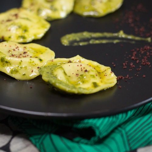 Vegan artichoke ravioli + sumac + aromatic herbs pesto 